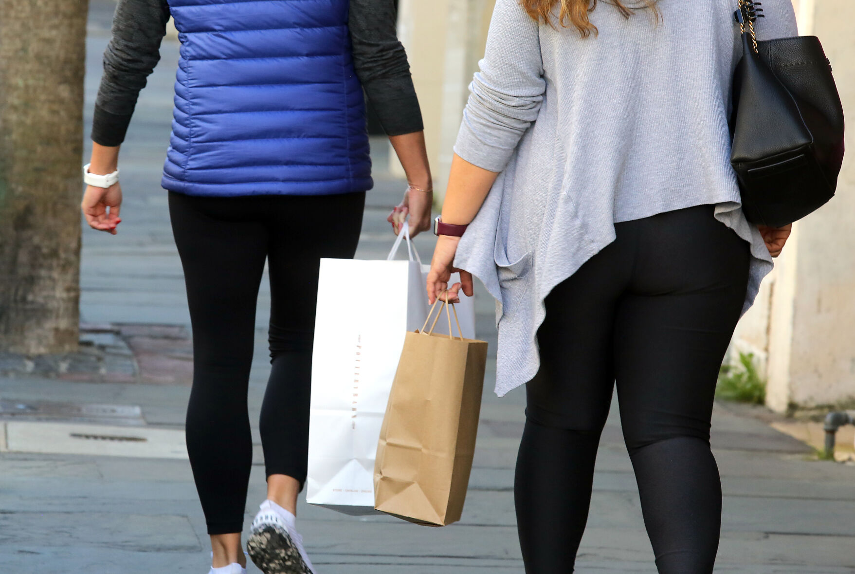 Christmas shopping with customers clutching bags